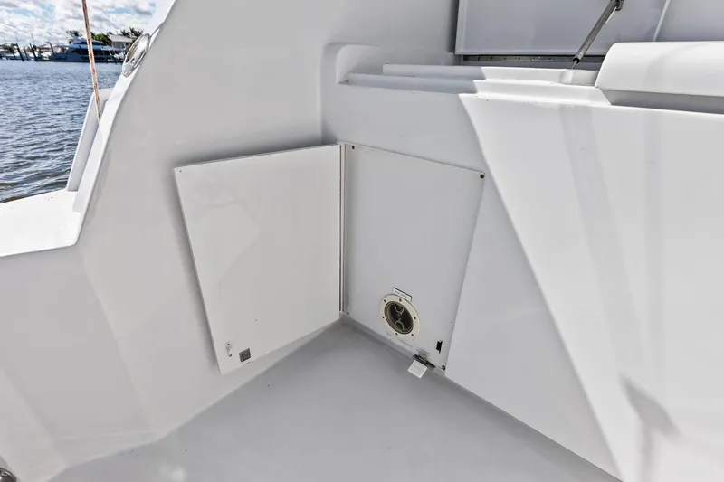 Slide: The Image of 2003 Hatteras 65 Convertible yacht interior detail with open storage compartment. - 14