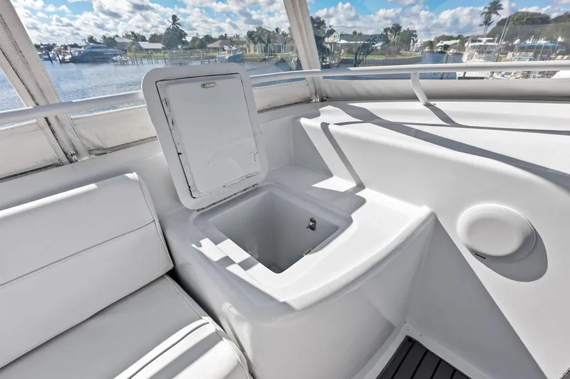 Slide: The Image of Interior view of 2003 Hatteras 65 Convertible yacht with seating and storage compartment. - 26