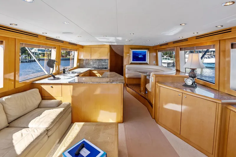 Slide: The Image of Luxurious interior of 2003 Hatteras 65 Convertible yacht with elegant wood finishes. - 28