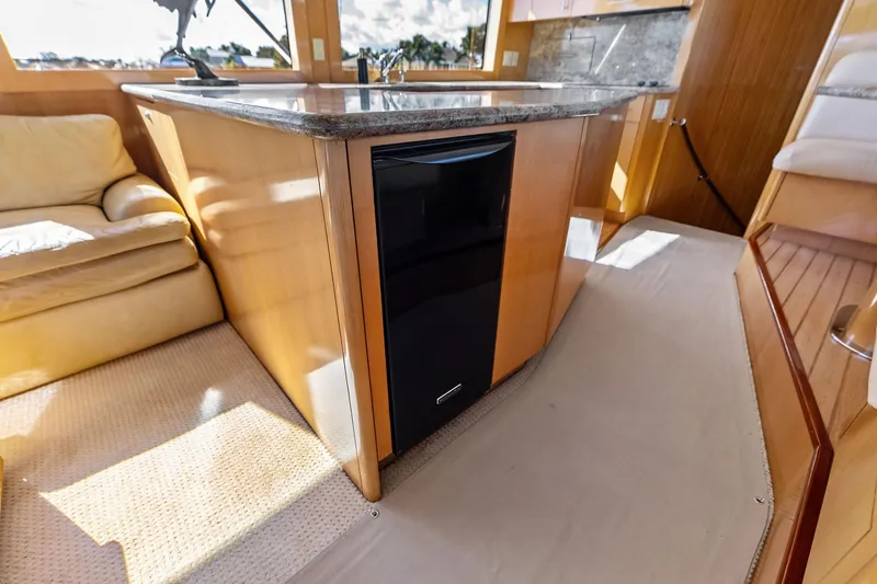 Slide: The Image of Luxurious interior of 2003 Hatteras 65 Convertible yacht with modern kitchen amenities. - 31