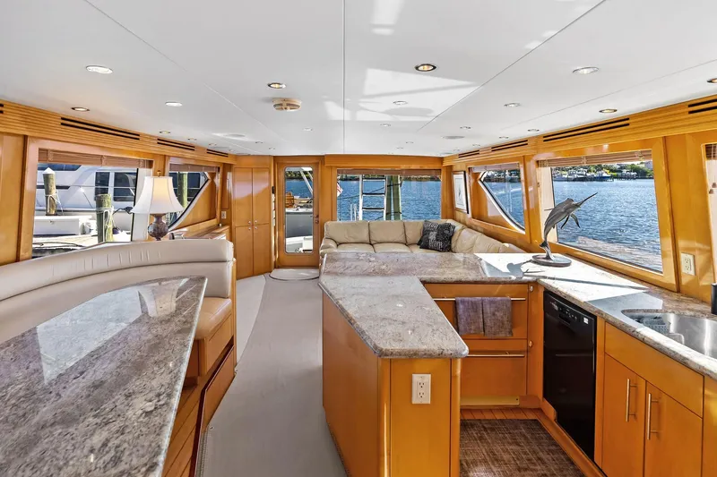 Slide: The Image of Luxurious interior of 2003 Hatteras 65 Convertible yacht with elegant furnishings and waterfront view. - 34
