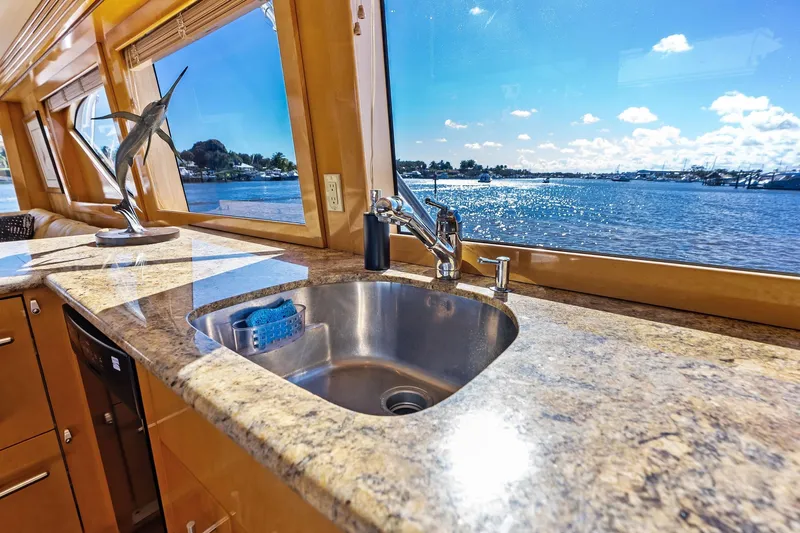Slide: The Image of Luxurious 2003 Hatteras 65 Convertible yacht interior with granite countertop and ocean view. - 40
