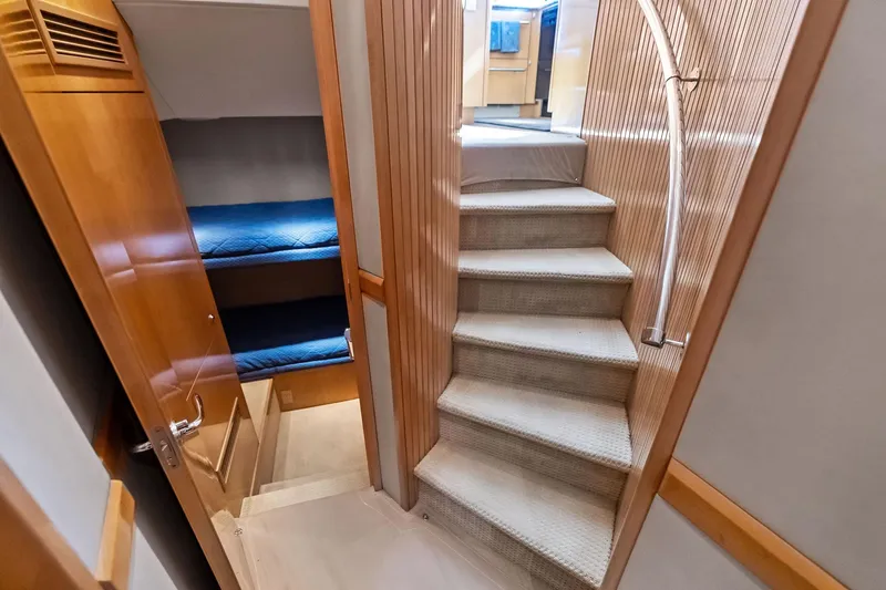 Slide: The Image of Interior of 2003 Hatteras 65 Convertible yacht with stairs and bunk beds. - 42