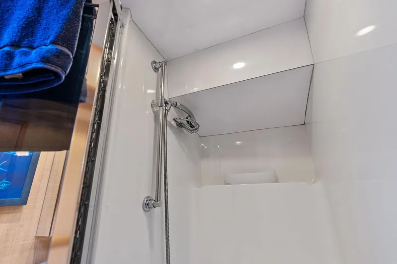 Slide: The Image of Shower area in 2003 Hatteras 65 Convertible yacht with modern fixtures. - 53
