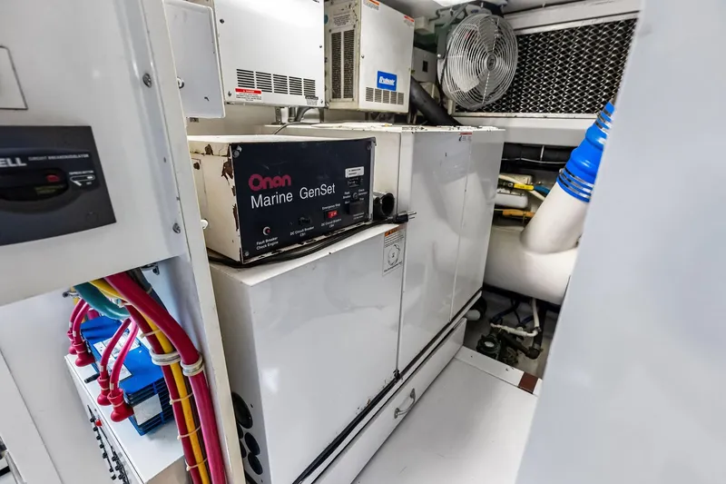 Slide: The Image of Engine room of 2003 Hatteras 65 Convertible with Onan Marine GenSet generator. - 65