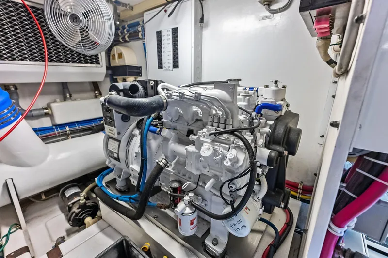 Slide: The Image of Engine room of 2003 Hatteras 65 Convertible yacht, showcasing detailed machinery and components. - 67