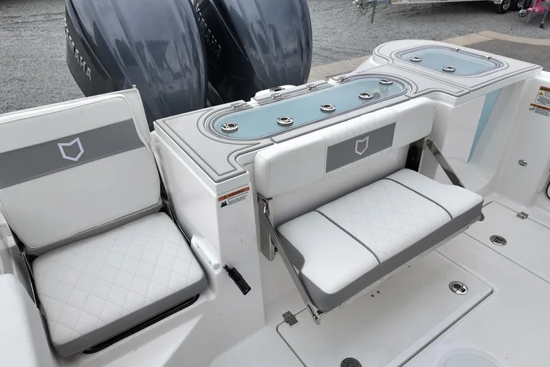 Slide: The Image of 2026 Sea Fox 288 Commander boat interior with cushioned seating and storage compartments. - 10