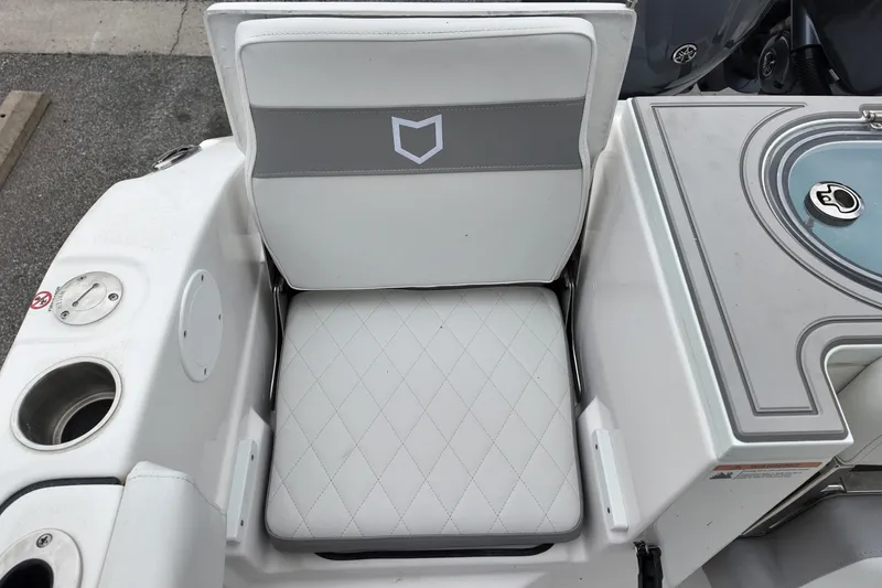 Slide: The Image of 2026 Sea Fox 288 Commander boat seat with diamond-stitched upholstery and integrated cup holder. - 11