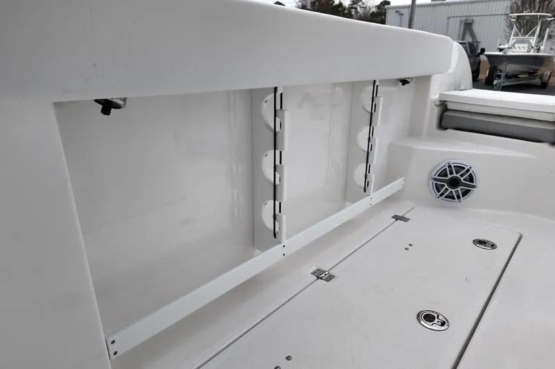 Slide: The Image of 2026 Sea Fox 288 Commander boat interior with storage compartment and speaker. - 13