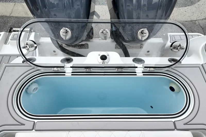 Slide: The Image of Open livewell on 2026 Sea Fox 288 Commander boat, showcasing interior and dual engines. - 17