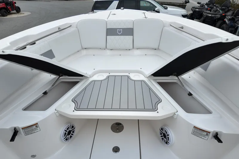 Slide: The Image of 2026 Sea Fox 288 Commander boat interior with open storage compartments and seating. - 20