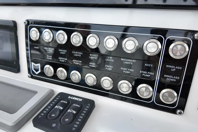 Slide: The Image of Control panel of 2026 Sea Fox 288 Commander boat with labeled buttons and switches. - 25