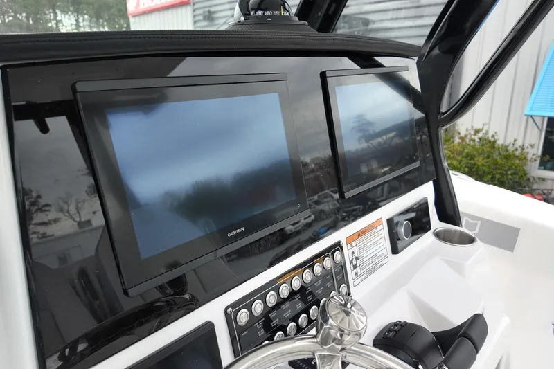 Slide: The Image of Dashboard of 2026 Sea Fox 288 Commander with dual Garmin displays and controls. - 27