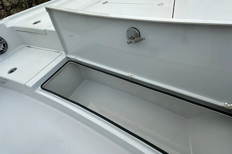 Slide: The Image of Open storage compartment on 2023 Pathfinder 2500 Hybrid boat deck. - 14