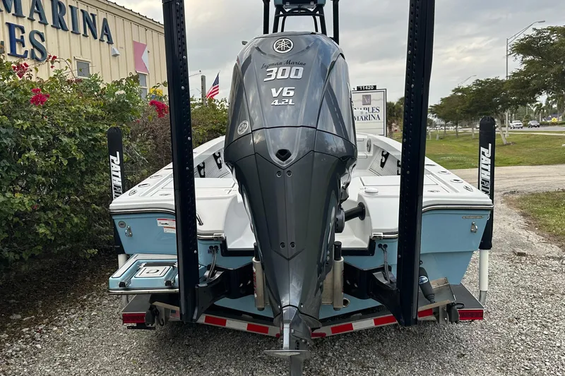 Slide: The Image of 2023 Pathfinder 2500 Hybrid boat with Yamaha 300 V6 engine at marina. - 2