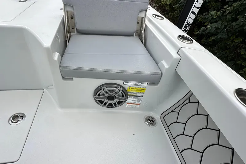 Slide: The Image of 2023 Pathfinder 2500 Hybrid boat interior with seating and speaker detail. - 20