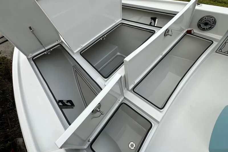 Slide: The Image of 2023 Pathfinder 2500 Hybrid boat storage compartments open, showcasing spacious interior design. - 22