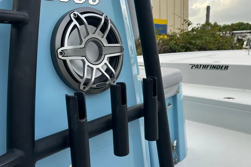 Slide: The Image of 2023 Pathfinder 2500 Hybrid boat with speaker and rod holders, blue exterior. - 4