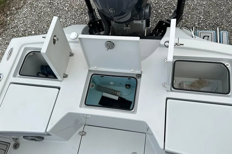 Slide: The Image of 2023 Pathfinder 2500 Hybrid boat storage compartments and engine detail. - 5