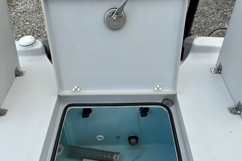 Slide: The Image of Open storage compartment on 2023 Pathfinder 2500 Hybrid boat, showing interior details. - 6