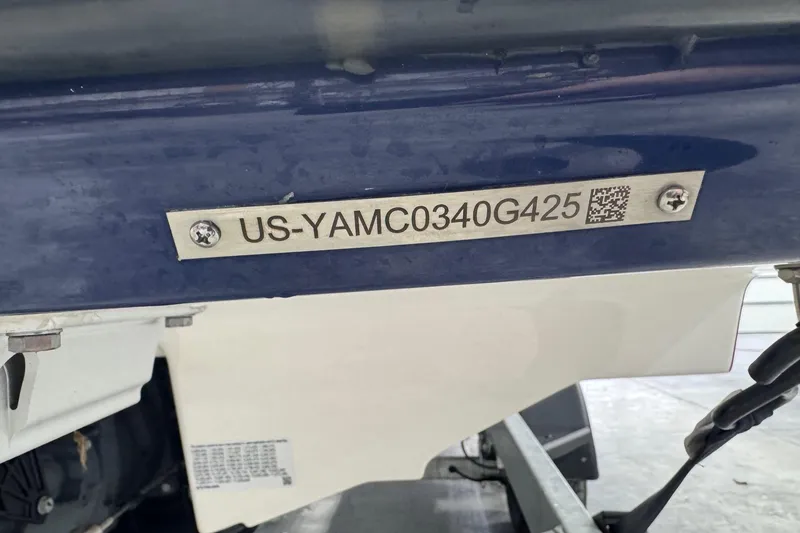 Slide: The Image of 2025 Yamaha Boats 252SE hull identification number plate close-up. - 23