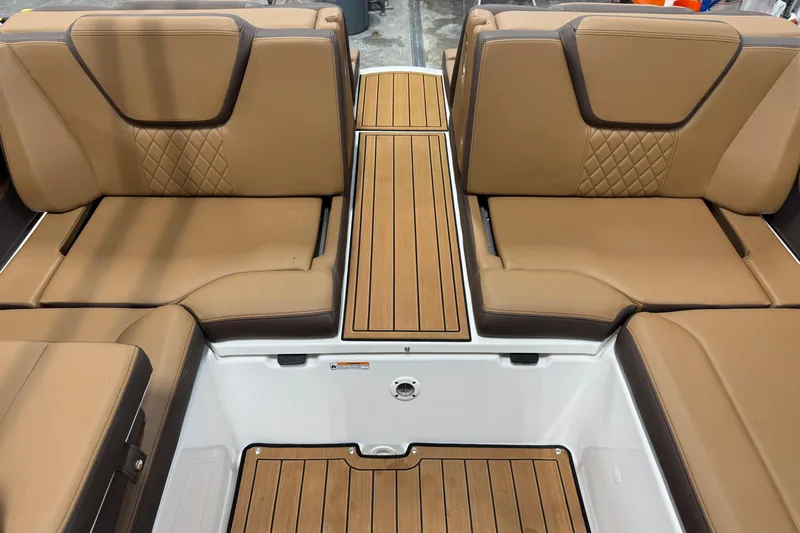 Slide: The Image of Luxurious tan seating on 2025 Yamaha Boats 252SE, featuring elegant diamond stitching and teak accents. - 6