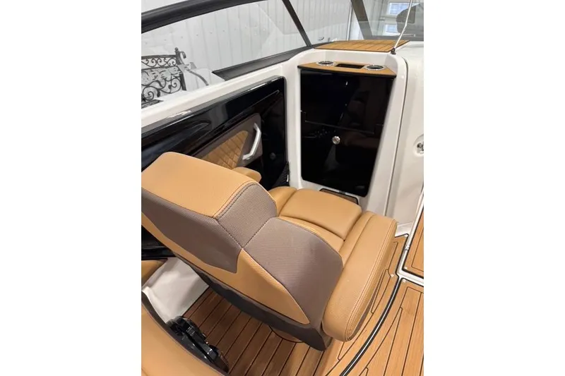 Slide: The Image of 2025 Yamaha Boats 252SE interior with tan seating and sleek design. - 9