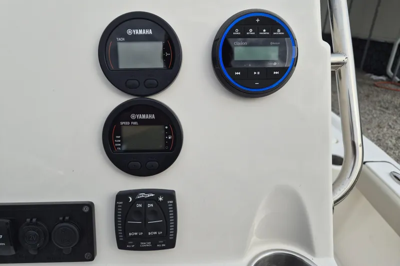 Slide: The Image of Dashboard of 2026 Key West 210 Bay Reef with Yamaha gauges and Clarion audio system. - 13