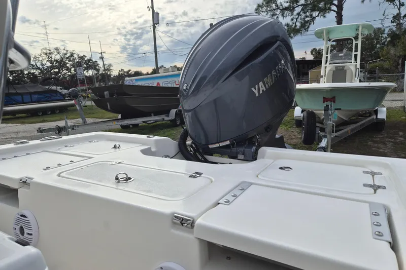 Slide: The Image of 2026 Key West 210 Bay Reef boat with Yamaha outboard motor, parked on a trailer. - 5
