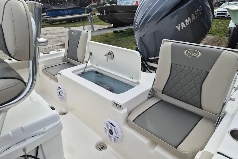 Slide: The Image of 2026 Key West 210 Bay Reef boat interior with seating and storage compartments. - 6