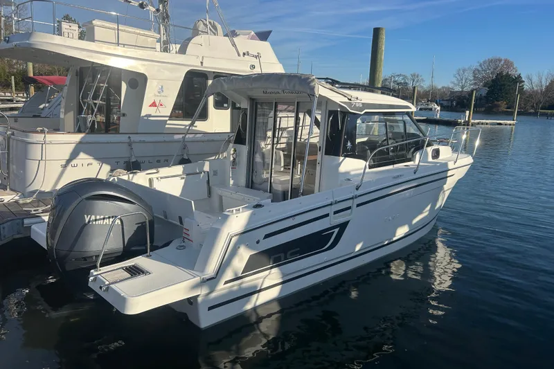 The Image of 2023 Jeanneau NC 795 Series 2 boat docked with Yamaha engine. - 1