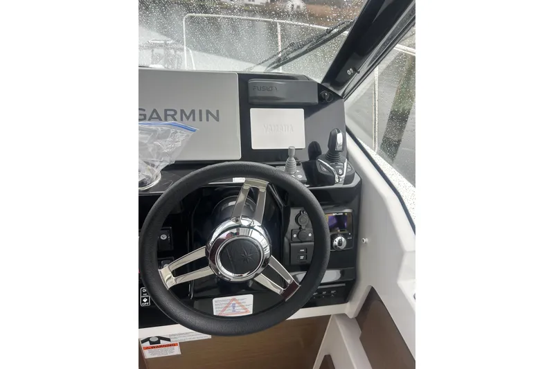 Slide: The Image of 2023 Jeanneau NC 795 Series 2 helm with Garmin navigation system. - 5