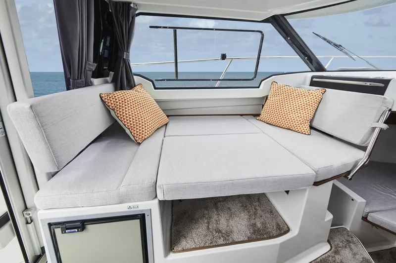 Slide: The Image of 2023 Jeanneau NC 795 Series 2 interior with cozy seating and ocean view. - 8