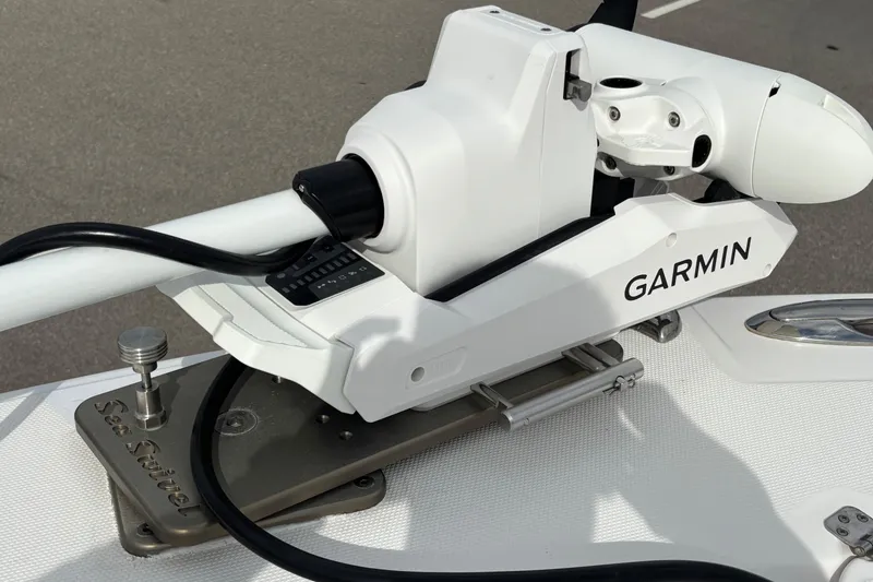 Slide: The Image of Garmin marine equipment on 2015 Edgewater 320CC boat, featuring Sea Sucker mount. - 15