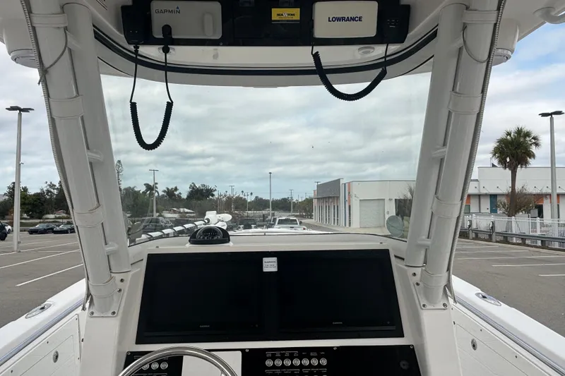 Slide: The Image of Interior view of 2015 Edgewater 320CC boat cockpit with navigation equipment. - 26