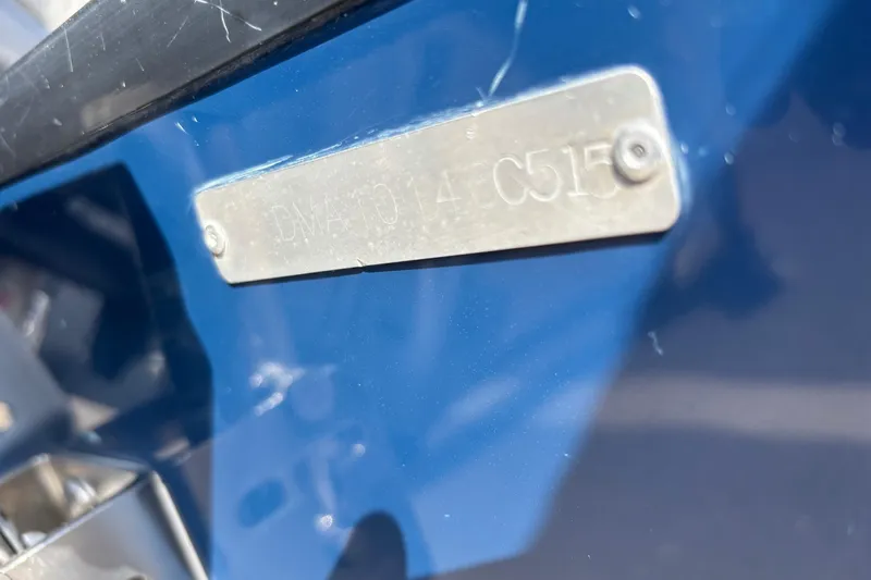 Slide: The Image of Close-up of a 2015 Edgewater 320CC boat's identification plate. - 32