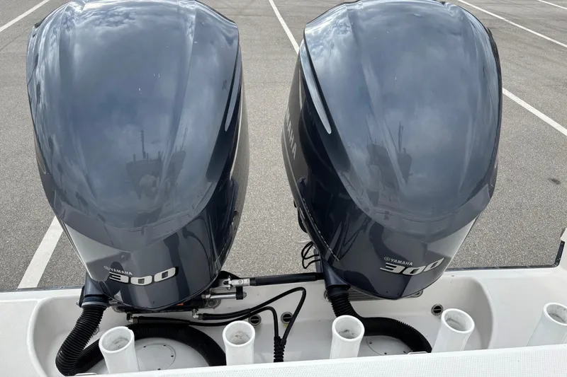 Slide: The Image of Twin Yamaha 300 outboard engines on a 2015 Edgewater 320CC boat. - 8