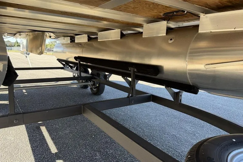 Slide: The Image of 2023 Sun Tracker Party Barge 20 DLX pontoon boat underside on trailer. - 17
