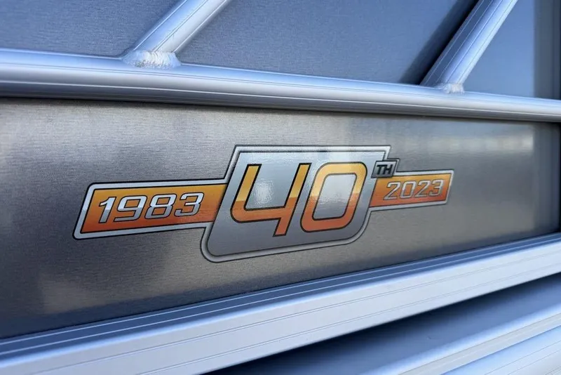 Slide: The Image of Sun Tracker Party Barge 20 DLX 40th anniversary emblem, 1983-2023 celebration. - 18