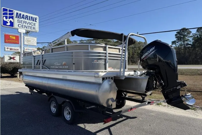 Slide: The Image of 2023 Sun Tracker Party Barge 20 DLX pontoon boat with Mercury engine on trailer. - 3