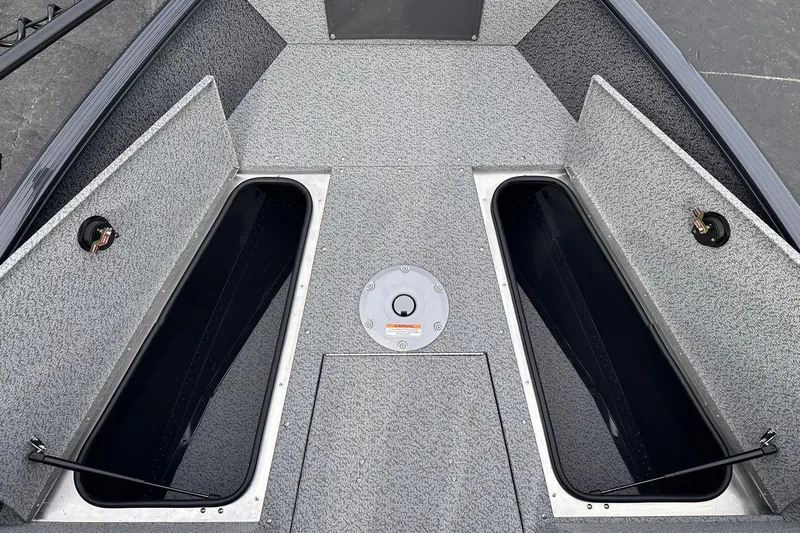 Slide: The Image of 2026 Lund 1775 Adventure Sport boat interior with open storage compartments. - 14