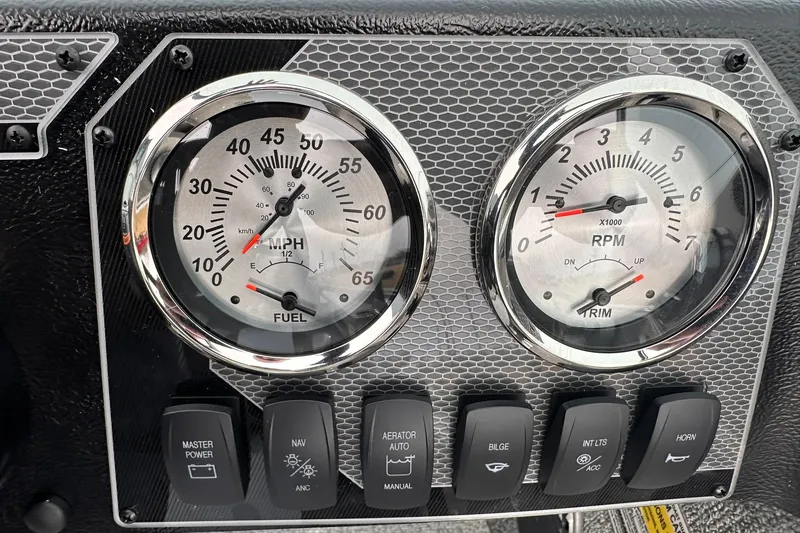 Slide: The Image of Dashboard of 2026 Lund 1775 Adventure Sport with speedometer, tachometer, and control switches. - 18