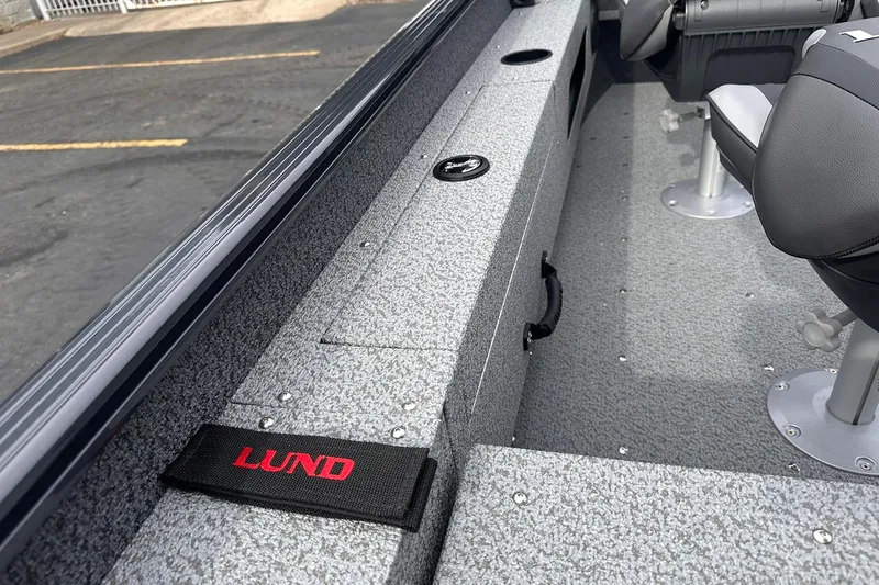 Slide: The Image of 2026 Lund 1775 Adventure Sport boat interior with seating and storage compartments. - 22
