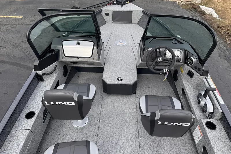 Slide: The Image of 2026 Lund 1775 Adventure Sport boat interior with dual seats and steering console. - 6