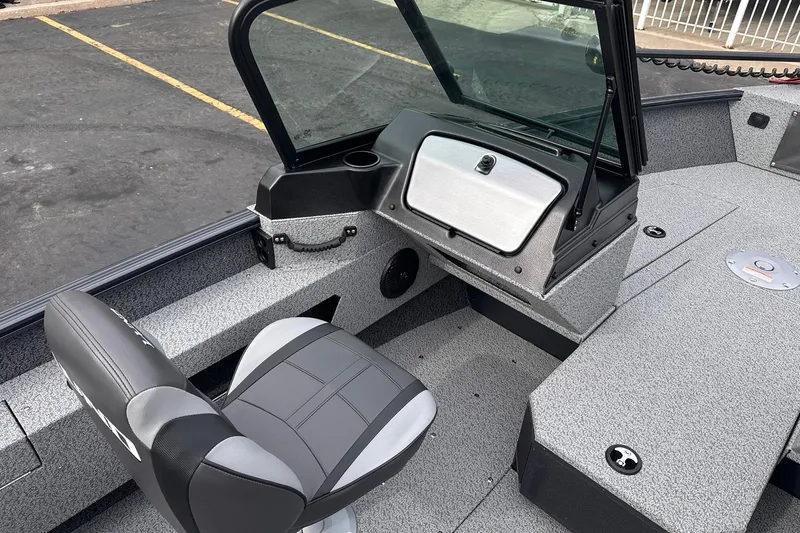 Slide: The Image of 2026 Lund 1775 Adventure Sport boat interior with seating and dashboard. - 8