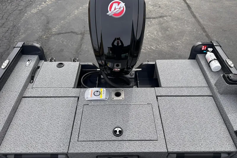 Slide: The Image of 2026 Lund 1775 Adventure Sport boat deck with motor and storage compartments. - 9