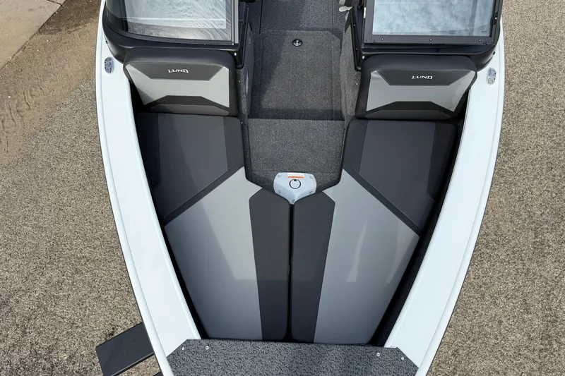 Slide: The Image of 2026 Lund 1875 Crossover XS boat interior, featuring sleek seating and modern design. - 10