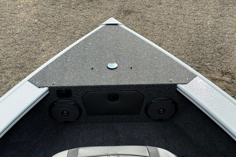 Slide: The Image of Bow of 2026 Lund 1875 Crossover XS boat with speakers and carpeted deck. - 12