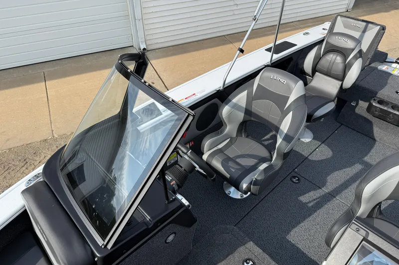 Slide: The Image of 2026 Lund 1875 Crossover XS boat interior with sleek seating and modern design. - 20