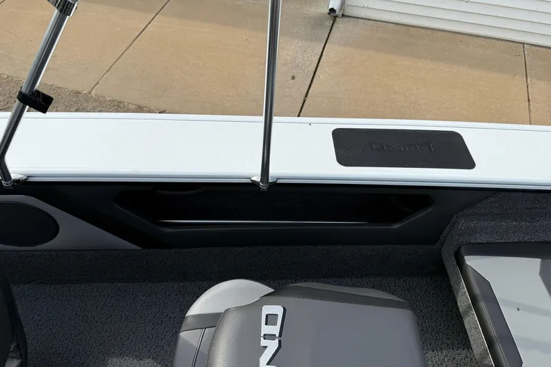 Slide: The Image of 2026 Lund 1875 Crossover XS boat interior with seating and storage features. - 28